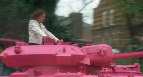 Alex Drake in a pink tank